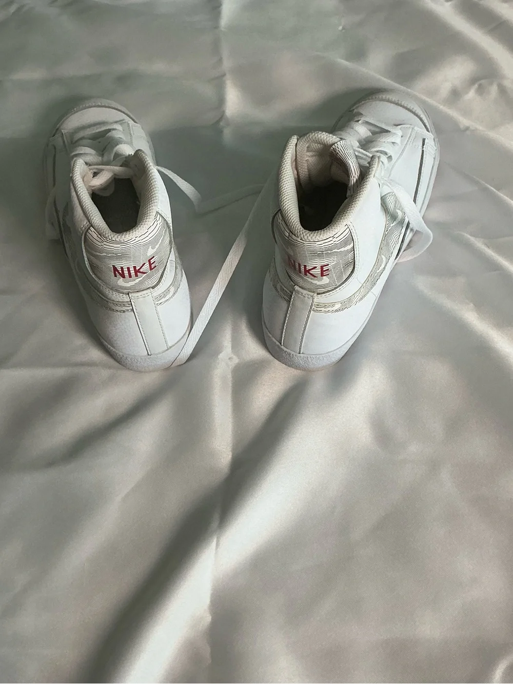 Nike White High-Top Sneakers with Red Logo